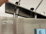 a hand that is reaching for something in a machine