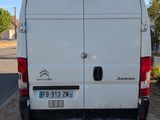a white van that is parked on the side of the road