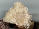 a small piece of rock with a lot of crystals on it