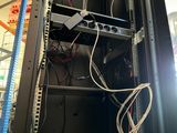a rack with wires and wires in it in a room