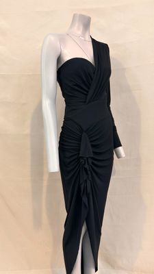 the mannequin is wearing a black dress with a bow on it