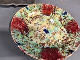a plate with a cake on it sitting on a table