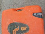 an orange case with a sticker on it sitting on the ground
