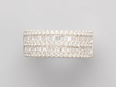 a white gold ring with baguets of diamonds