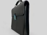 a black briefcase on a white background with a blue tag