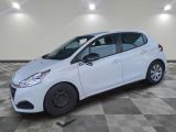 a white car parked in a room with a checkered floor