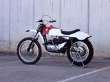 a white and red motorcycle parked in a parking lot