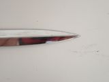 a knife that has been cut in half on the table