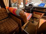 a view of the inside of a bus from the driver ' s seat