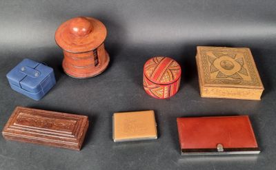 five small boxes and a small box on a table