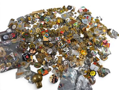 a pile of assorted metal items on a white surface