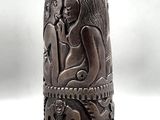 an image of a wooden figurine of a woman and a cat