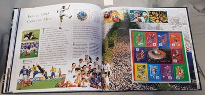 an open book with pictures of soccer players on it