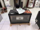 a microwave that is sitting on a pallet in a store