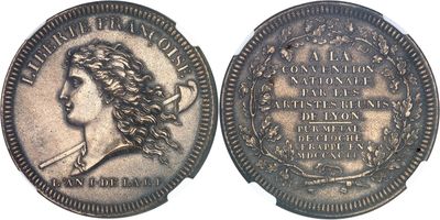 a close up of a coin with a woman ' s face on it