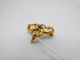 a close up of a gold ring with a diamond on it