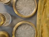 a lot of silver and gold items on the table