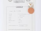 a piece of paper with a stamp on it and a piece of paper with a coin on it
