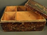 an old wooden box sitting on top of a table next to another box