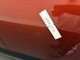 a sticker on the hood of a red car