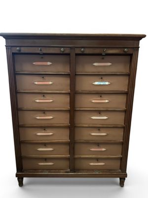an image of a wooden chest of drawers