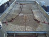 a trailer with a chain attached to the back of it