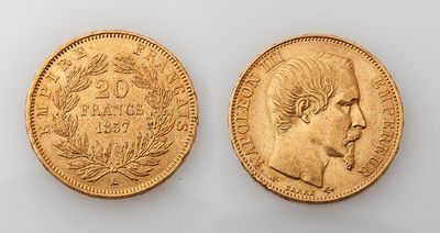 two gold sovereigns, one of which has a head of a man and the other of a woman