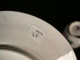 a close up of a plate and a cup on a table