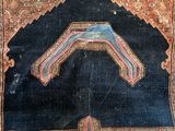 an old rug with a design on it on the floor