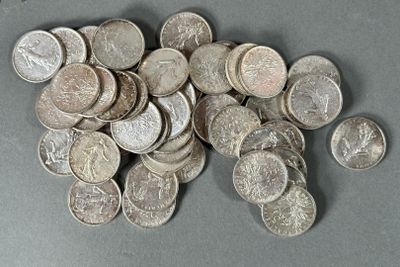 a pile of silver coins sitting on a table