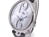 a close up of a wrist watch with a white dial