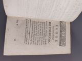 an open book with a picture of a man on it