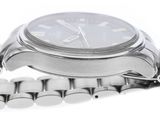 a close up of a watch on a silver bracelet