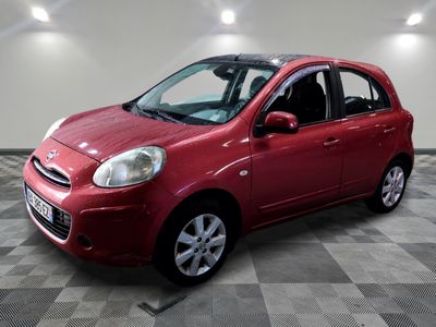 a picture of a red car parked in a garage