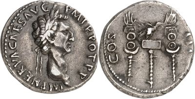 a silver coin with an image of a woman and a man on it