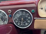 a close up of a car dashboard with a clock on it