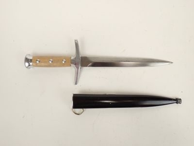 two different types of knives on a white surface