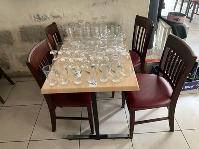 a table with a lot of wine glasses on it