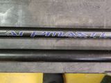 a close up of two fishing rods sitting on top of a table