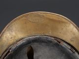 a close up view of a hat with a gold rim