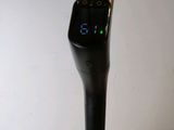 a microphone with a digital display on the top of it