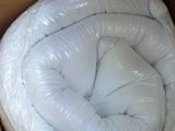 a box with a mattress inside of it and a pillow inside of it