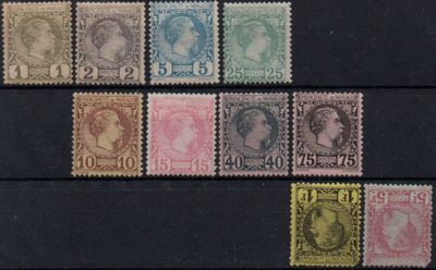 a close up of a group of stamps on a black surface