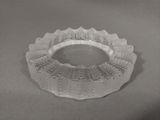 a glass bowl that is sitting on a table