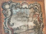 a picture of a tapestry with a picture of a castle on it