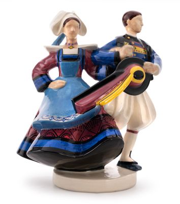 a figurine of a man and a woman holding a guitar