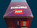 a box of legos sitting on a blue surface