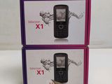 two boxes of cell phones sitting on top of each other on a table