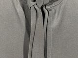 a close up of a dress with a tie on a mannequin mannequin mannequin mannequin mannequin mannequin mannequin