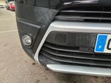 a close up of a black car with a number plate on it